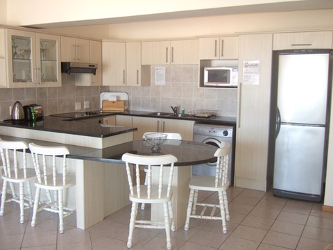 First floor, 2 bedroom, 2.5 bathroom, open kitchen/lounge - , spacious balcony with braai, limited seaview